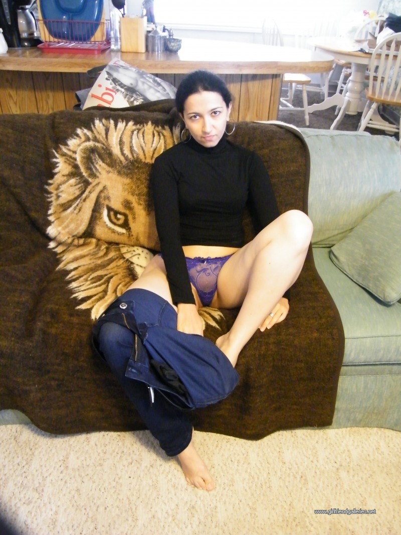 Curvy wife takes her jeans off on the couch 